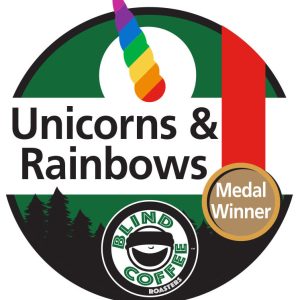 Unicorns and Rainbows Icon with Blind Coffee logo and a rainbow colored unicorn horn and a medal